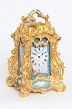 A rare French gilt bronze rococo case sevres porcelain mounted carriage clock by Drocourt, circa 1870